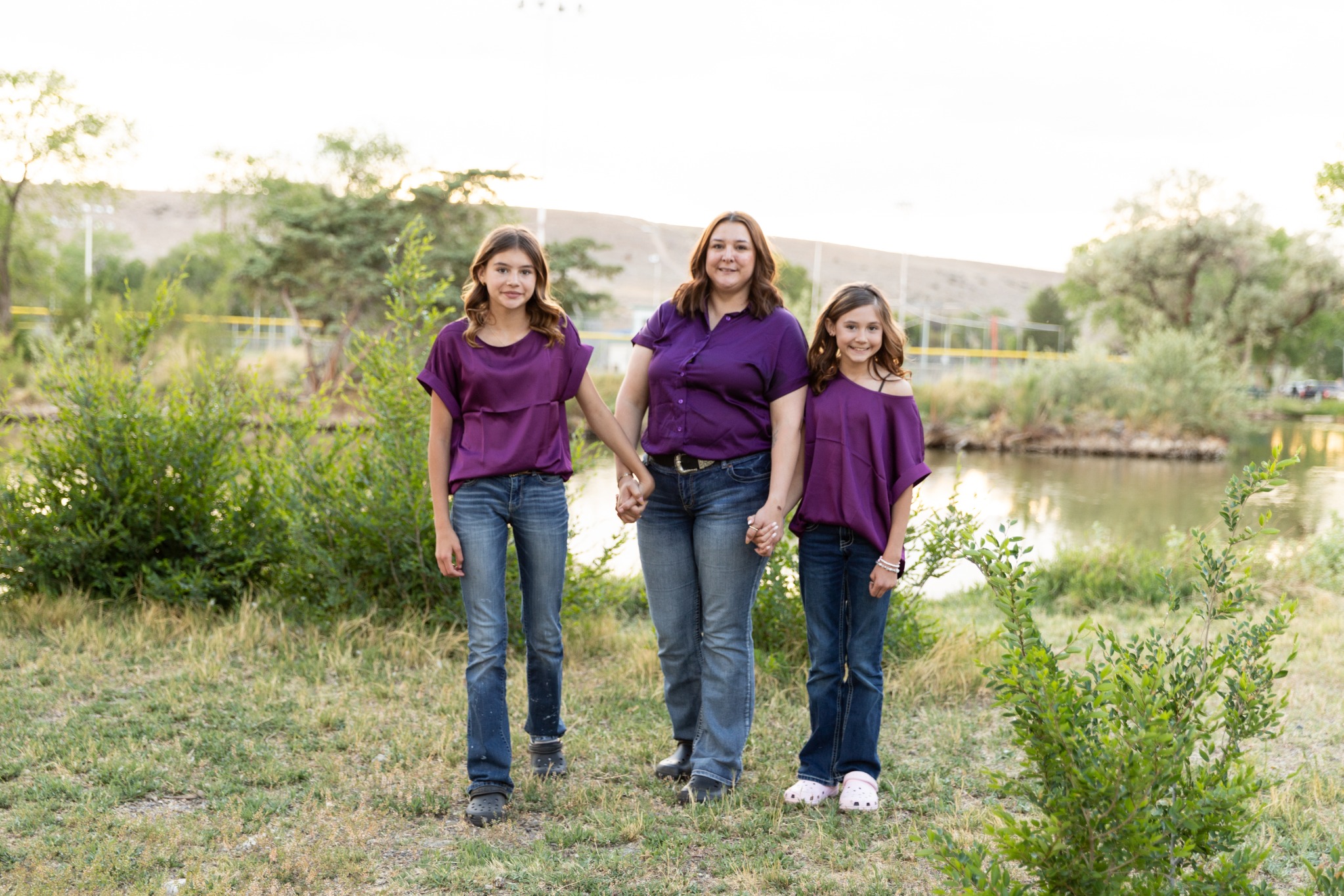 Janel with her daughters outdoors